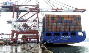 A container ship being loaded in Qingdao, Shandong province, China.